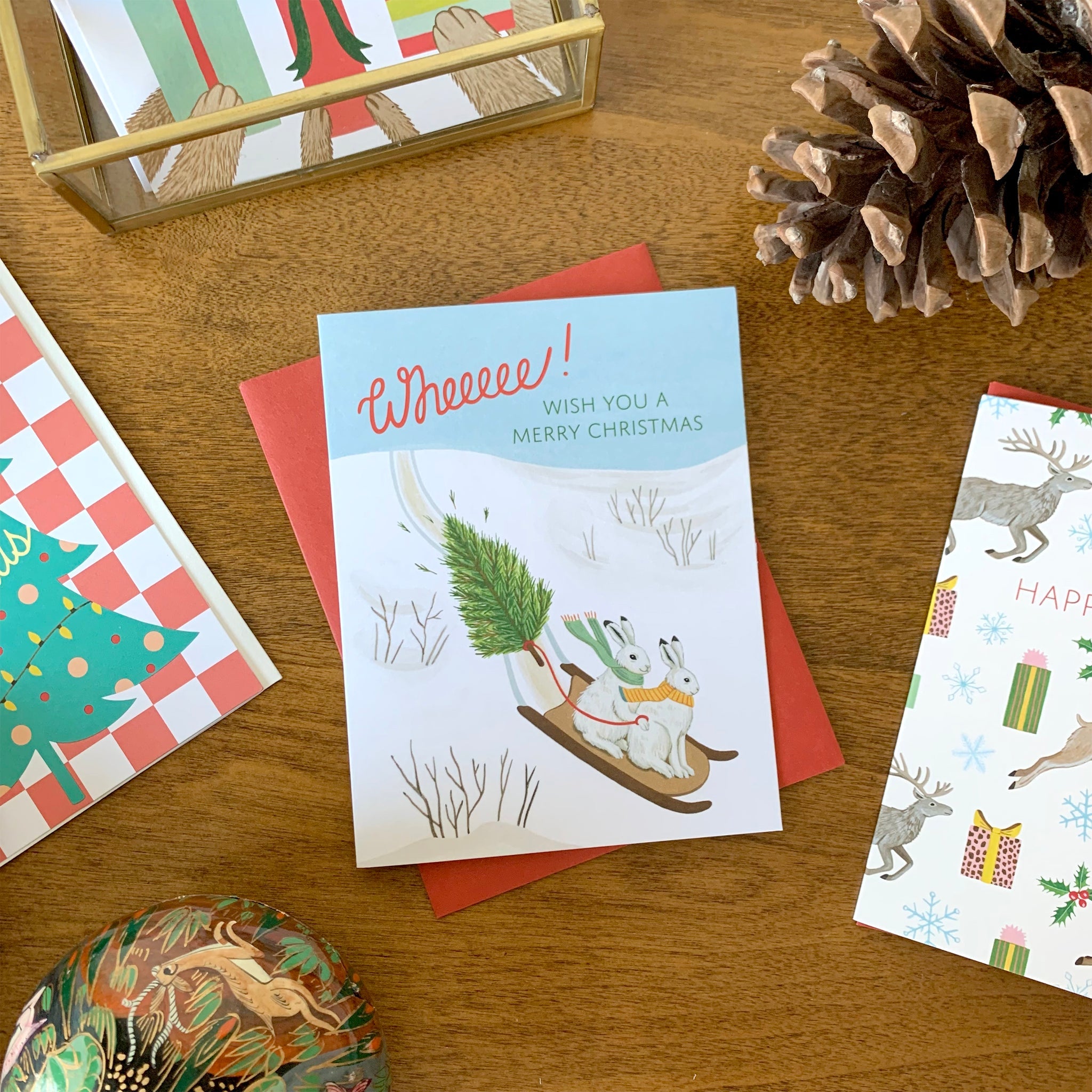 Arctic Hares Sledding Holiday Card