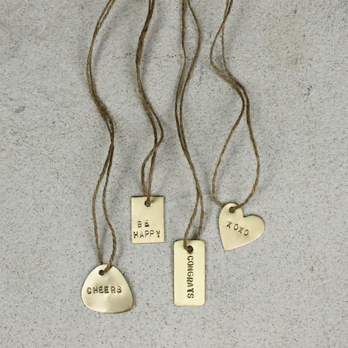 Load image 1 in gallery view. Brass Tag - XOXO