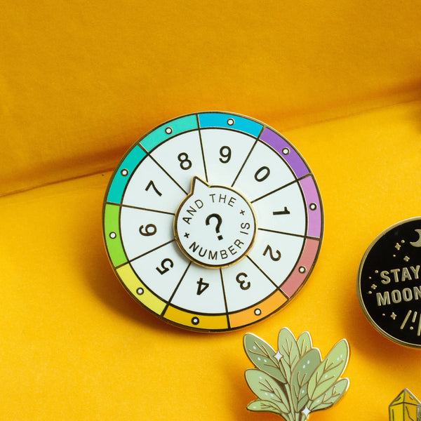 Spinning Numbers Enamel Pin